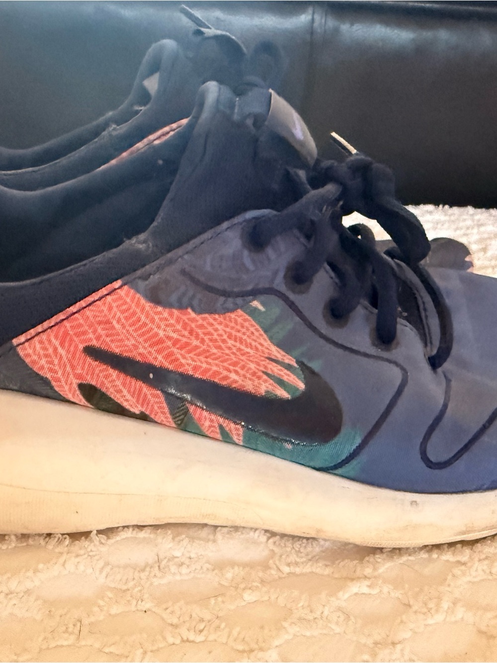 Nike Blue Sneakers with Coral Floral Accent and Black Swoosh